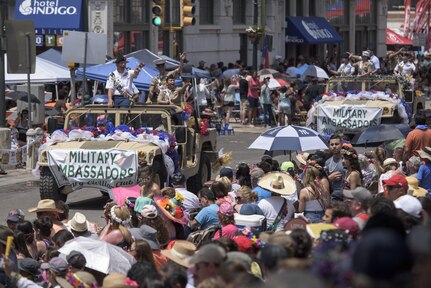 Joint Base San Antonio Military Fiesta Ambassadors take part in the 2017 Battle of Flowers Parade April 28, 2017, in San Antonio, Texas. Fiesta San Antonio is a 10-day celebration of military history to honor the life and memory of the members who died in the Battle of the Alamo and the Battle of San Jacinto. (U.S. Air Force photo by Senior Airman Stormy Archer)