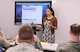 Alejandra Locke, 302nd Force Support Squadron, briefs members of the 302nd Logistics Readiness Squadron during a Lunch & Learn education session, March 5, 2017, here. The Lunch & Learn is an opportunity for Reservists to receive financial information and awareness of the services available through the Airman and Family Readiness Center.  Locke is the 302nd Airlift Wing community readiness consultant. Citizen Airmen can request an appointment to meet with her during the week or during any Unit Training Assembly by calling (719) 556-2944. (U.S. Air Force photo/Staff Sgt. Amber Sorsek) 