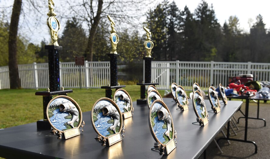 Trophies are lined up to be presented to winners during the Annual McChord Field Top III Children’s Fishing Derby April 29, 2017 at Carter Lake on McChord Field, Wash. More than 100 people came out to participate in this year’s fishing derby. (U.S. Air Force Photo/ Staff Sgt. Naomi Shipley)