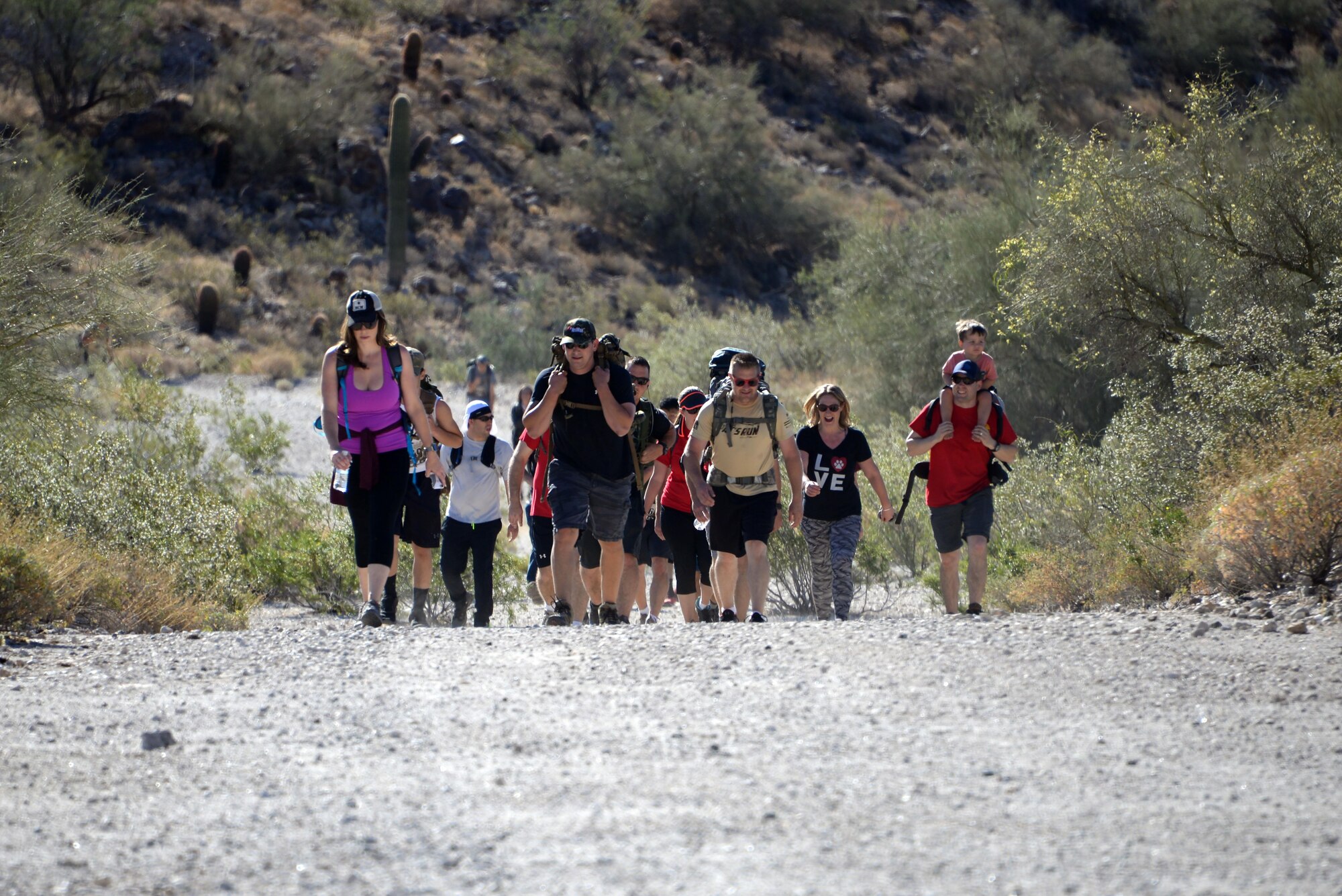 March of the Fallen participants hike through White Tank Mountain Regional Park April 29, 2017 in Waddell, Ariz.  The MOTF is a 4.5-mile rucksack march dedicated to honoring those who gave their lives during Operation Enduring Freedom, Operation Iraqi Freedom and Operation New Dawn.(U.S. Air Force photo by Devante Williams)