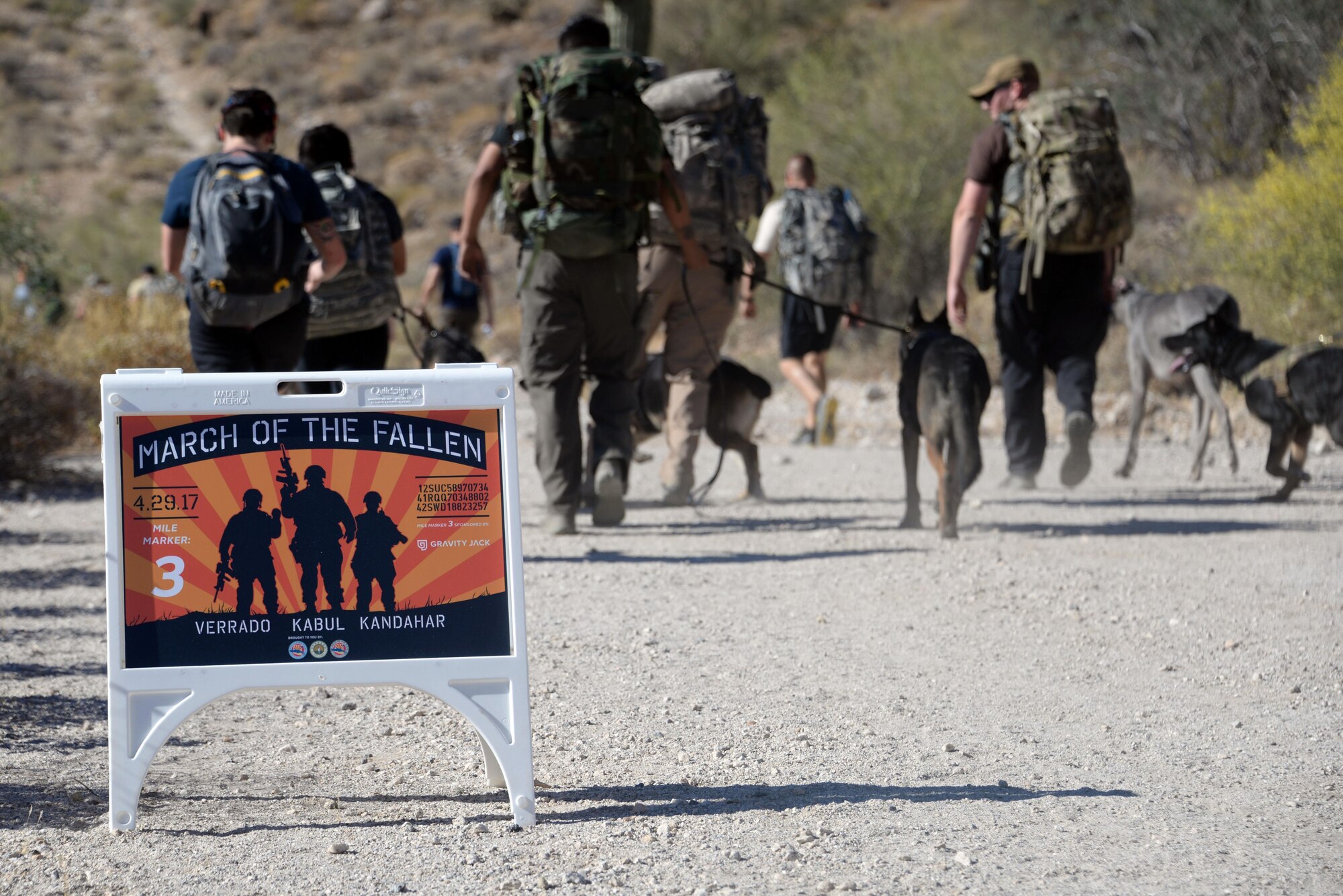 March of the Fallen pass mile three marker during the ruck march through White Tank Mountain Regional Park April 29, 2017 in Waddell, Ariz.  Proceeds from the even benefit the Wounded Warrior Project and Luke Airmen’s Fund. (U.S. Air Force photo by Devante Williams)