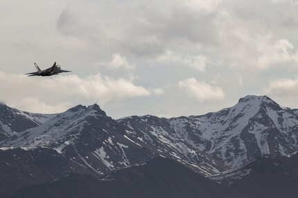 A U.S. Air Force F-22 Raptor aircraft with 3rd Wing, soars through the skies above Joint Base Elmendorf-Richardson, Alaska, signifying the start of exercise Northern Edge 2017, May 1, 2017. This exercise is Alaska’s largest and premier joint training exercise designed to practice operations, techniques and procedures as well as enhance interoperability among the services. Thousands of participants from all the services, Airmen, Soldiers, Sailors, Marines and Coast Guard personnel from active duty, Reserve and National Guard units are involved.