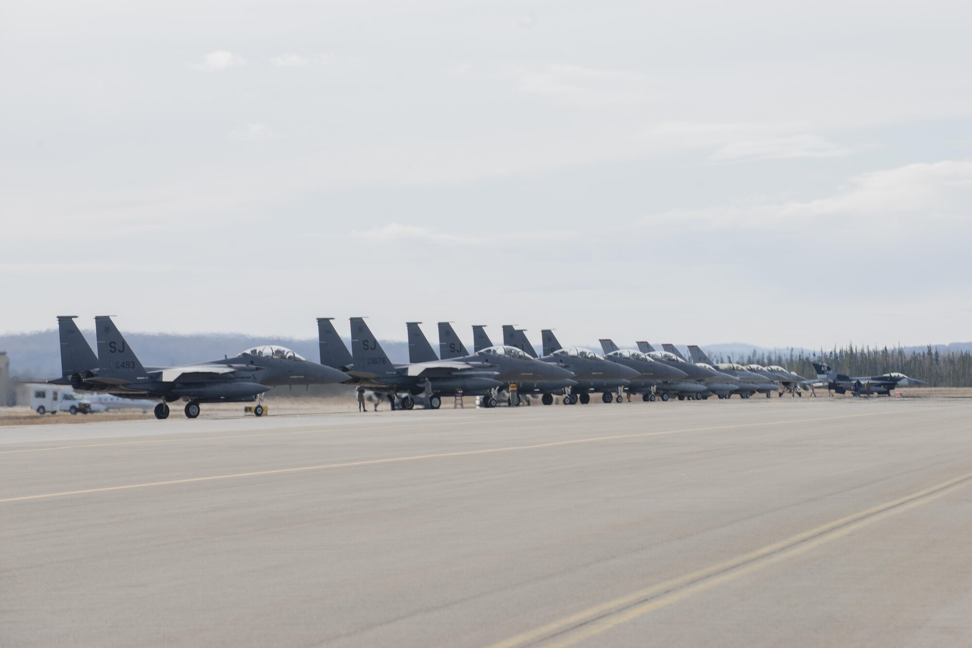 EIELSON AIR FORCE BASE, Alaska – U.S. Air Force aircraft assigned to the 335th Fighter Squadron, Seymour Johnson Air Force Base, N.C., the 13th Fighter Squadron, Misawa Air Base, Japan, and the 18th Aggressor Squadron, prepare for a sortie during NORTHERN EDGE 2017 (NE17) May 1, 2017, at Eielson Air Force Base, Alaska. NE17 is Alaska’s premier joint training exercise designed to practice operations, techniques and procedures as well as enhance interoperability among the services. Thousands of participants from all the services, Airmen, Soldiers, Sailors, Marines and Coast Guardsmen from active duty, Reserve and National Guard units are involved. (U.S. Air Force photo/Staff Sgt. Ashley Nicole Taylor)