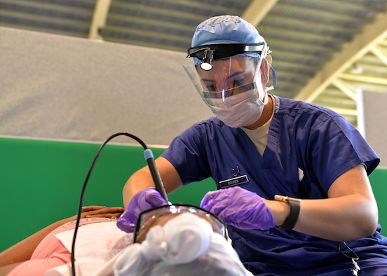 U.S. Air Force Staff Sgt. Teresa Booker, a dental assistant with the 81st Dental Squadron out of Keesler Air Force Base, Miss., performs a dental cleaning in Azua, Dominican Republic, March 14, 2017, during a dental readiness training exercise as part of NEW HORIZONS 2017. NEW HORIZONS began in the mid-1980s and is an annual exercise to train military civil engineers and medical professionals to deploy and conduct joint operations. (U.S. Air Force photo by Master Sgt. Karen J. Tomasik)