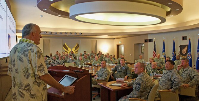 Former University of Hawaii (UH) head football coach June Jones speaks with Pacific Air Forces (PACAF) senior leaders during the PACAF hosted commander's conference at Joint Base Pearl Harbor-Hickam, Hawaii, April 26, 2017. At UH, Jones guided the Rainbow Warriors to what was the biggest single-season turnaround in NCAA history, taking a program that had gone 0-12 before his arrival to 9-4 in 1999, leaving the school as the winningest head coach with a 76-41 record over nine seasons. The three-day conference included a wide variety of topics and several guest speakers, preparing leaders in PACAF to remain poised to retain a competitive advantage in the evolving Pacific theater. (U.S. Air Force photo by Tech. Sgt. Kamaile Chan)
