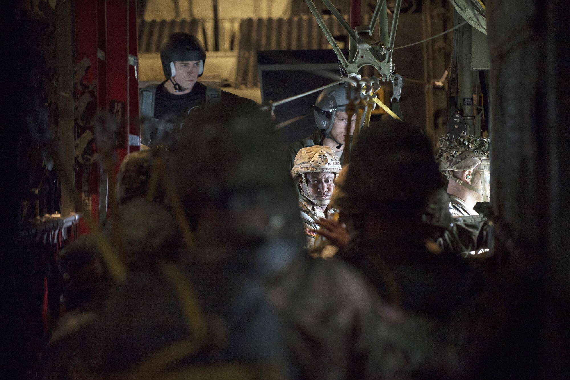 A jumpmaster inspects paratroopers prior to a jump over Mimon, Czech Republic, during Exercise Saber Junction 17 on Aviano Air Base, Italy, April 27, 2017. Air Force photo by Senior Airman Cory W. Bush