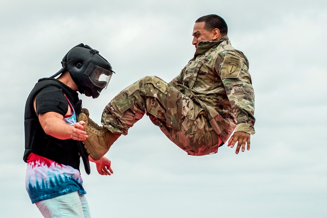 A soldier demonstrates combat techniques on a volunteer from the audience during the 6th Ranger Training Battalion’s open house at Eglin Air Force Base, Fla., April 29, 2017. The event allowed the public to learn how Rangers train and operate. Air Force photo by Samuel King Jr.