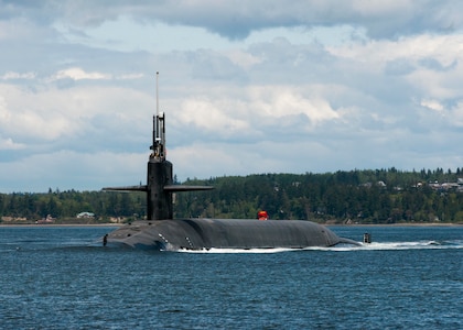 The Gold Crew of the Ohio-class ballistic-missile submarine USS Alabama (SSBN 731) transits the Hood Canal April 28, 2017, as the boat returns home to Naval Base Kitsap-Bangor following a routine strategic deterrent patrol. Alabama is one of eight ballistic-missile submarines stationed at the base, providing the most survivable leg of the strategic deterrence triad for the United States. 