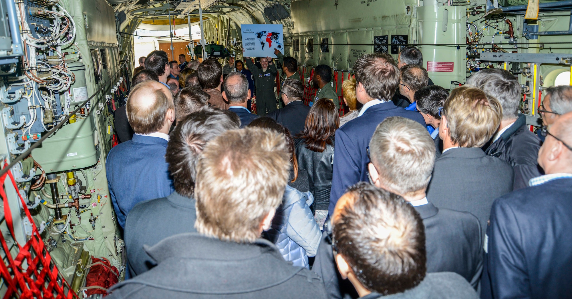 Technical Sgt. Pablo Vasquez, 86th Aeromedical Evacuation Squadron aeromedical evacuation technician, briefs civilian medical providers on the 86th AES’s area of responsibility during a tour on Ramstein Air Base, Germany, April 27, 2017. When a military member is unable to receive the medical care they need at a military facility, local medical providers often take charge of their care. (U.S. Air Force photo/Staff Sgt. Timothy Moore)