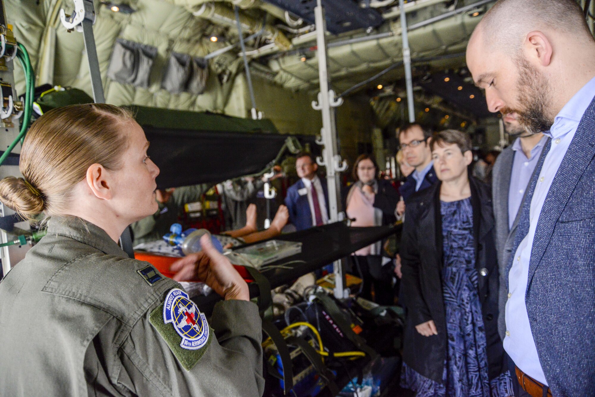 Capt. Tracy Davis, 86th Aeromedical Evacuation Squadron flight nurse, answers questions from local national medical providers during a tour on Ramstein Air Base, Germany, April 27, 2017. The biennial tour is designed to show medical providers from the Kaiserslautern Military Community the services the 86th AES and 86th Medical Group provide. It also aims to solidify the partnership between military and local civilian medical providers, who often take care of military members and their families when military facilities are unable to provide adequate medical care. (U.S. Air Force photo/Staff Sgt. Timothy Moore)