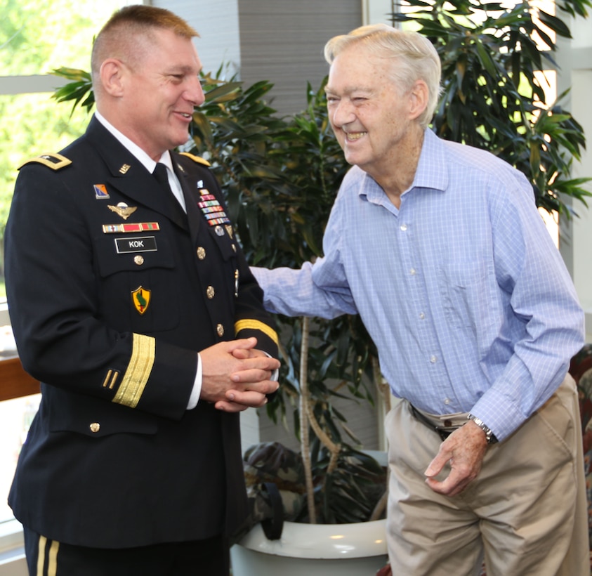 Maj. Gen. Troy D. Kok, commanding general of the U.S. Army Reserve’s 99th Regional Support Command, shares a moment with Claude Hodges, a 99th Infantry Division veteran who served during the Battle of the Bulge and is currently a resident at the Virginia Veterans Care Center in Roanoke, Virginia. Kok visited Hodges and other veterans at the center April 28.