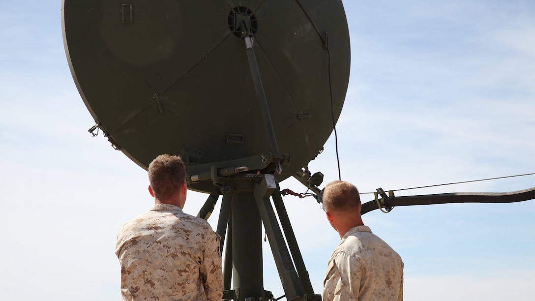 Sgt. Matthew George, left, and Cpl. Austin Hardin inspect the dish of the Tropospheric Scatter Microwave Radio Terminal, or the AN/TRC-170, during the Weapons and Tactics Instructor Course 2-17 near Marine Corps Air Station Yuma, Ariz., April 26, 2017. The AN/TRC-170 has been utilized by the Marine Corps since the 1980’s and is used to transmit data, internet, phone and emails to a point target within 100 nautical miles. George and Hardin are both AN/TRC-170 operators assigned to Marine Wing Communications Squadron 28, Marine Air Control Group 28, 2nd Marine Aircraft Wing.