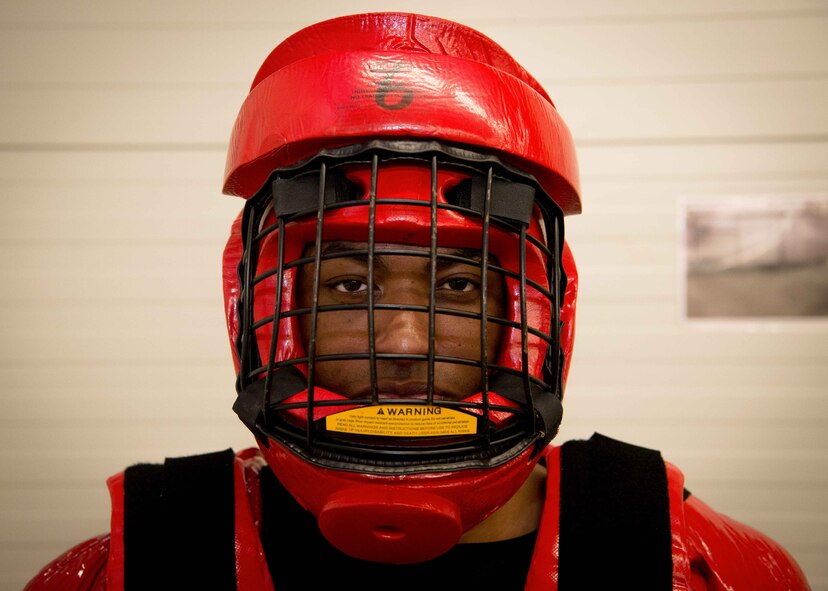 Staff Sgt. Stephaun Mckinley, 86th Security Forces Squadron alpha assistant flight chief, poses in protective gear on Ramstein Air Base, Germany, April 27, 2017. The 86 SFS used the gear to train potential Ravens on how to execute baton strikes with proper stance and technique. The baton training is part of a full-day course which determines the suitability of security forces personnel for the Phoenix Raven qualification course on Fort Dix, NJ. (U.S. Air Force photo by Senior Airman Elizabeth Baker/Released)