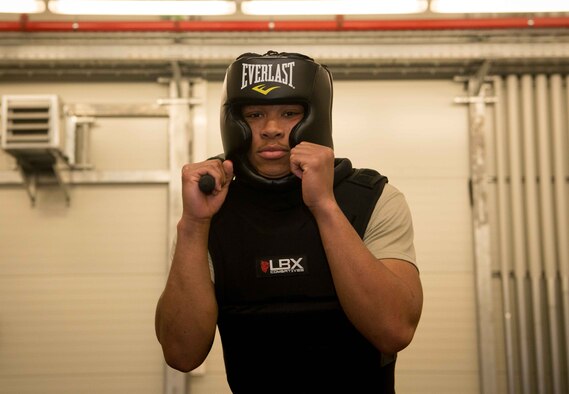 Airman 1st Class Cameron Rogers, 86th Security Forces Squadron control center technician, poses with a baton and protective gear on Ramstein Air Base, Germany, April 27, 2017. Rogers participated in preliminary training to become a Raven, specialized security forces personnel who travel with aircraft in order to provide ground security wherever the aircraft lands. Ravens may travel to austere locations where they are the only security available for their aircraft. (U.S. Air Force photo by Senior Airman Elizabeth Baker/Released) 
