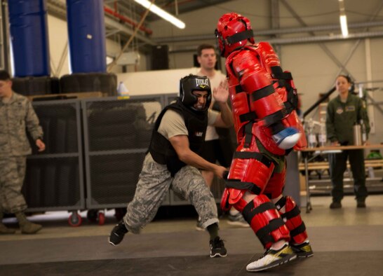Airman 1st Class Damien Monreal, left, 86th Security Forces Squadron alarm monitor, uses a baton to practice defending himself against Tech. Sgt. James Vetter, 435th Security Forces Squadron operations support NCO, on Ramstein Air Base, Germany, April 27, 2017. Monreal participated in baton training against multiple aggressors to tests his endurance and prepare him for Phoenix Ravens qualification training, where he will learn help detect, deter and counter threats to Air Mobility Command aircraft. (U.S. Air Force photo by Senior Airman Elizabeth Baker/Released)