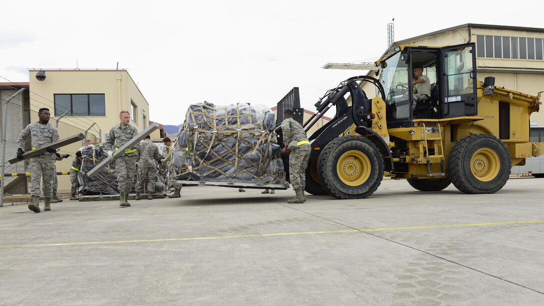 Airmen from the 31st Logistics Readiness Squadron move cargo with a 10K All-Terrain Forklift at Aviano Air Base, Italy, April 19, 2017. The 31st LRS assisted in deploying 344 service members from Aviano Air Base to Bagram Airfield. (U.S. Air Force photo by Airman 1st Class Ryan Brooks)