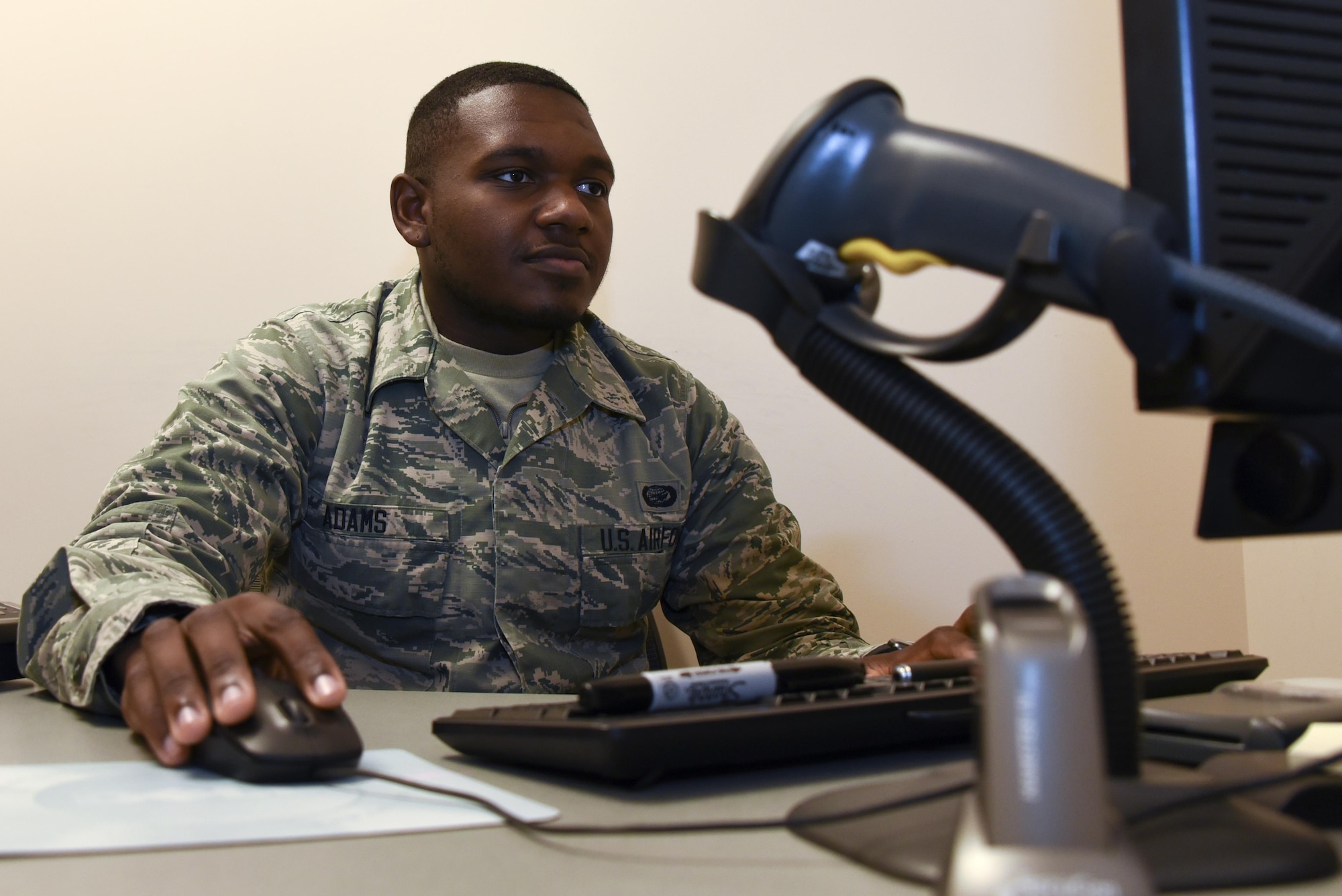 AB Avery Adams prepares to issue a common access card April 27, 2017 at Warfield Air National Guard Base, Middle River, Md. Adams is the May 2017 Spotlight Airman. (U.S. Air National Guard photo by SrA Enjoli Saunders/RELEASED) 
