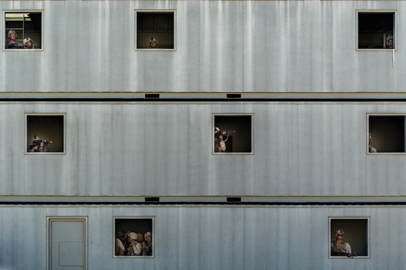 U.S. Marines watch for enemy activity during an urban clear exercise as part of Integrated Training Exercise 2-16 at Marine Corps Air Ground Combat Center, Twentynine Palms, Calif., Feb. 11, 2016. MCAGCC conducts relevant live-fire combined arms, urban operations, and joint/coalition level integration training that promote operational forces' readiness. (U.S. Air Force photo by Senior Airman Steven A. Ortiz)