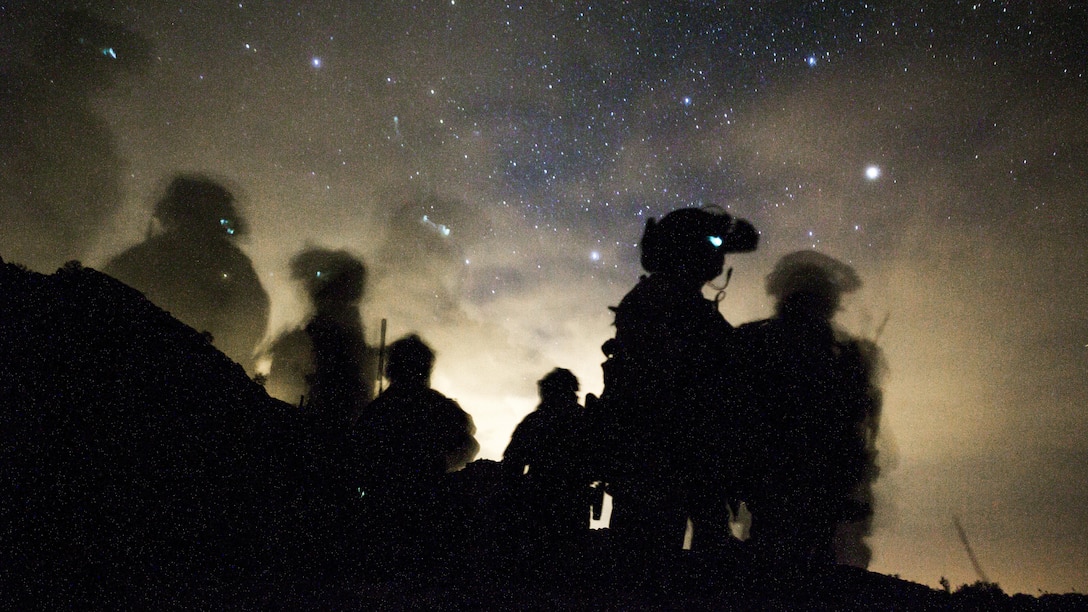 U.S. Marines with 1st Marine Raider Battalion, Marine Raider Regiment, Marine Corps Forces Special Operations Command, await departure during final exercise two as part of Weapons and Tactics Instructors Course 2-17, near Yuma, Arizona, April 27, 2017. This exercise was designed to execute a simulated special operating forces raid while simultaneously supporting regimental combat team objectives and focusing on conducting all six functions of Marine Aviation. WTI was a seven-week training event hosted by Marine Aviation and Weapons and Tactics One cadre, which emphasizes operational integration of the six functions of Marine Corps aviation in support of a Marine Air Ground Task Force and provides standardized advanced tactical training and certification of unit instructor qualifications to support Marine Aviation Training and Readiness and assists in developing and employing aviation weapons and tactics. 