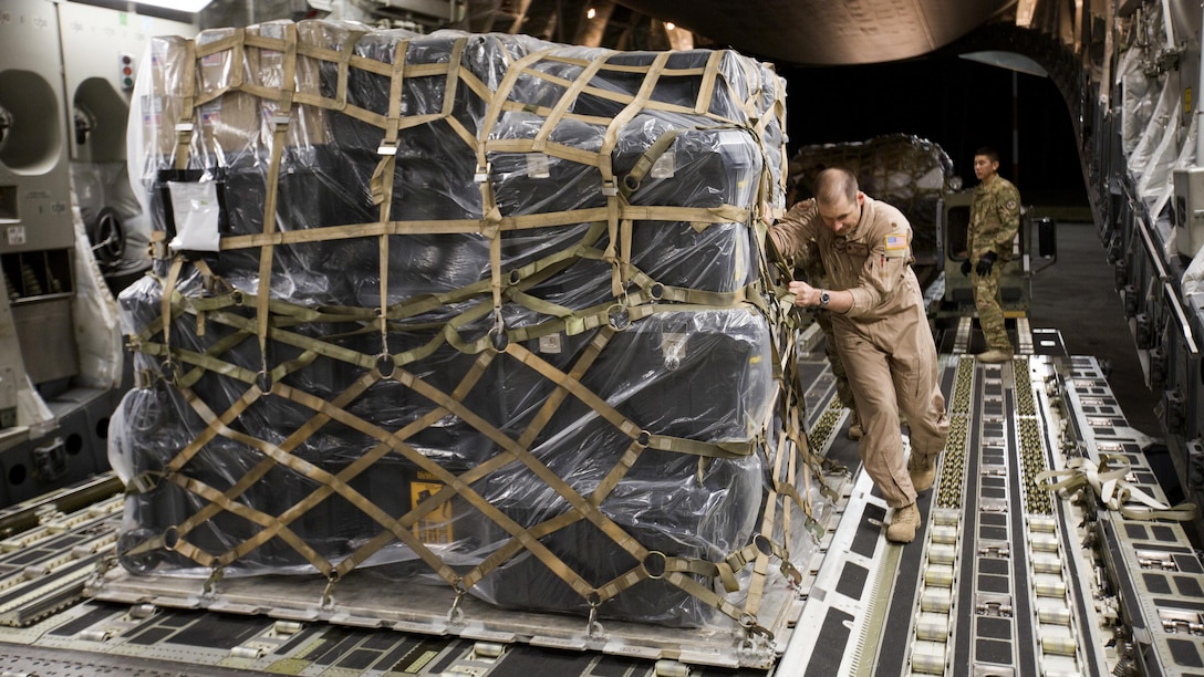U.S. Air Force Maj. Robert Riggs, U.S. Marine Corps Forces, Special Operations Command air mobility liaison officer, assists in loading cargo aboard a C-17 aircraft at Marine Corps Air Station Cherry Point, North Carolina. As MARSOC’s AMLO, Riggs provides a critical link of communication between the airlift and ground forces in the area of operations. He facilitated the mission from planning and coordination through hands-on facilitation by piloting the aircraft as it deployed and re-deployed two MARSOC units.