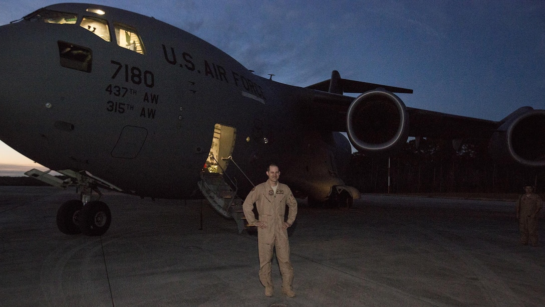 U.S. Air Force Maj. Robert Riggs, U.S. Marine Corps Forces, Special Operations Command air mobility liaison officer, prepares for his C-17 mission on the flight line at Marine Corps Air Station Cherry Point, North Carolina. Riggs drove down to Charleston, S.C., to operate the C-17 scheduled to deploy a Marine Special Operations Company to Africa and bring back a separate MSOC. The total flight took four days and visited four different countries on three continents.