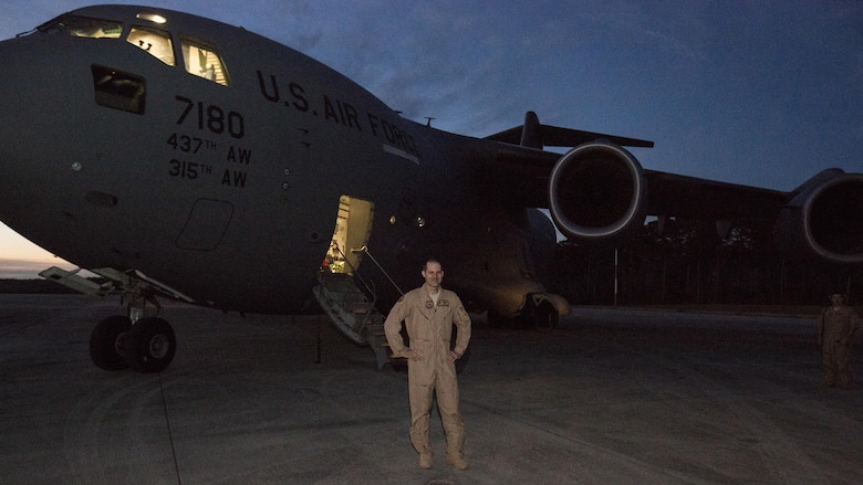 U.S. Air Force Maj. Robert Riggs, U.S. Marine Corps Forces, Special Operations Command air mobility liaison officer, prepares for his C-17 mission on the flight line at Marine Corps Air Station Cherry Point, North Carolina. Riggs drove down to Charleston, S.C., to operate the C-17 scheduled to deploy a Marine Special Operations Company to Africa and bring back a separate MSOC. The total flight took four days and visited four different countries on three continents.