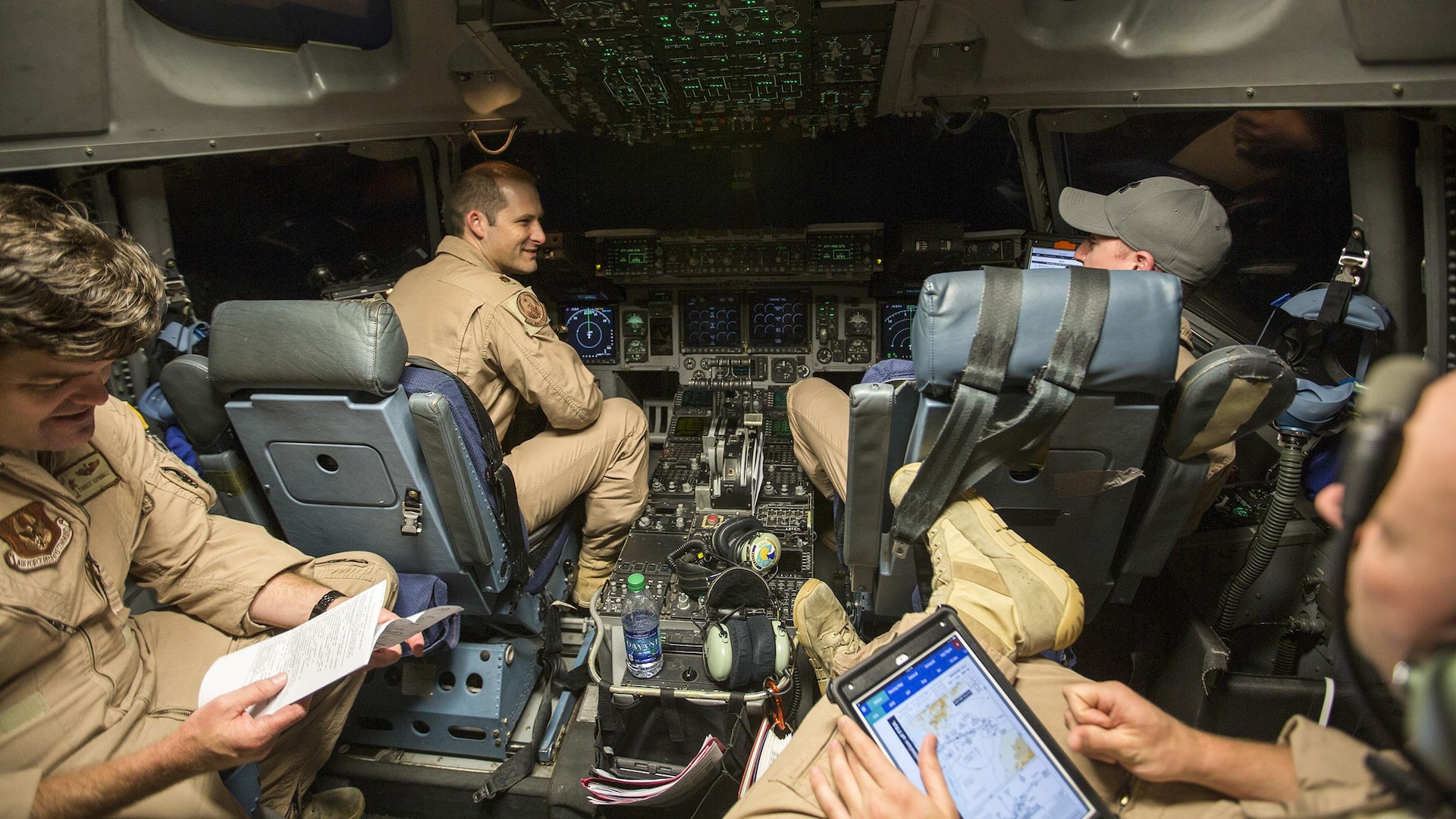 U.S. Air Force Maj. Robert Riggs, U.S. Marine Corps Forces, Special Operations Command air mobility liaison officer, prepares for his mission on the flight deck of a C-17 aircraft at Marine Corps Air Station Cherry Point, North Carolina. As MARSOC’s AMLO, Riggs provides a critical link of communication between the airlift and ground forces in the area of operations. He facilitates the timely flow of critical information between the air mobility network and MARSOC units into sensitive, forward-deployed environments around the globe. 