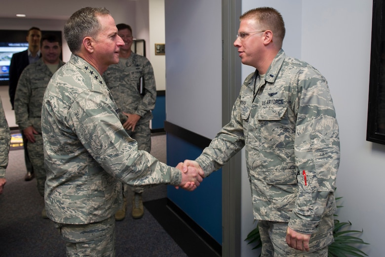 Air Force Chief of Staff Gen. David L. Goldfein recognizes 1st Lt. Jacob Myers, 45th Operations Group, for his accomplishments following a tour of the Morrell Operations Center, April 30, 2017, at Cape Canaveral Air Force Station, Fla. The tour included a brief by members of the 1st Range Operations Squadron, as well as a visit to the 45th Weather Squadron and the mission control room where he received and up-close and personal look at the space and launch mission at the 45th Space Wing. (U.S. Air Force photo/Matthew Jurgens) 