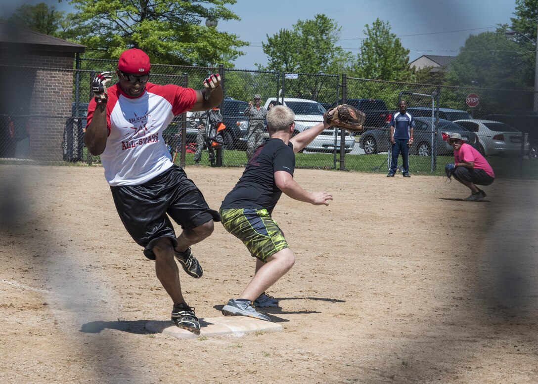 Community members play softball during a Sexual Assault Awareness and Prevention Month event at Joint Base Andrews, Md., April 28, 2017. The goal of SAAPM is to raise cognizance about sexual harassment and violence, and inform military members how to prevent it. The month’s events also included a proclamation signing, informational walk and pledge making. (U.S. Air Force photo by Senior Airman Jordyn Fetter)