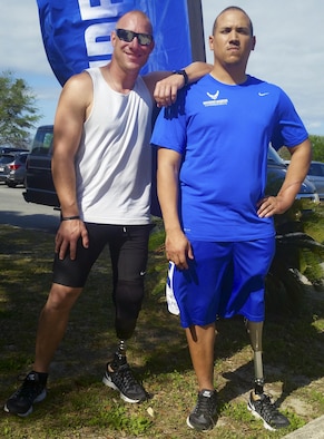 Ben Seekell, left, and Brian Williams, Warrior Games athletes, share experiences between events at the Air Force team’s training camp at Eglin Air Force Base, Fla., April 26. The base-hosted, week-long Warrior Games training camp is the last team practice session before the yearly competition in June. (U.S. Air Force photo/Kevin Gaddie)