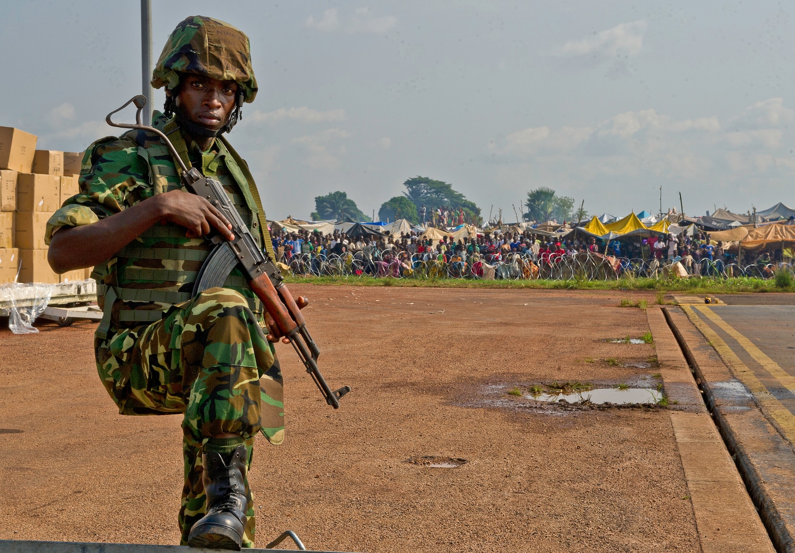 A Burundi soldier posts security at the Bangui Airport, Central African Republic (CAR) in late 2013. In coordination with the French military and African Union, the U.S. military provided airlift support to help enable African forces to deploy promptly to prevent further spread of sectarian violence and restore security in CAR. 