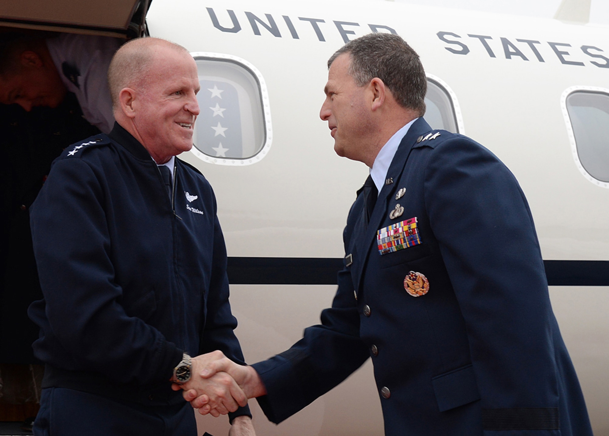 Air Force Vice Chief of Staff Gen. Stephen W. Wilson is welcomed to Hanscom Air Force Base, Mass., by Maj. Gen. Dwyer L. Dennis, program executive officer for C3I and Networks, on the base flightline May 2. Wilson came to Hanscom to attend meetings at Massachusetts Institute of Technology Lincoln Laboratory. (U.S. Air Force photo by Linda LaBonte Britt)