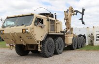 Members of the U.S Army Reserve 851st Transportation Company, based in Sinton, Texas, use a M1075A1 Palletized Load System to deliver a refrigerated conex during Vibrant Response and Guardian Response near Camp Atterbury, Indiana, Apr. 25, 2017.  Vibrant Response and Guardian Response bring together military, federal and state agencies from throughout the continental U.S. for three weeks of collective training simulating the response to a catastrophic Chemical Biological Radiological Nuclear (CBRN) event in a major U.S. city.  (U.S. Army Reserve Photo by Maj. Brandon R. Mace)