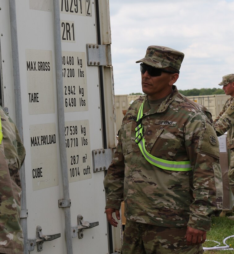 U.S Army Reserve Sgt. 1st Class Ralph Salas, from the 851st Transportation Company, based in Sinton, Texas, oversees the delivery of equipment and supplies during Vibrant Response and Guardian Response near Camp Atterbury, Indiana, Apr. 25, 2017.  Vibrant Response and Guardian Response bring together military, federal and state agencies from throughout the continental U.S. for three weeks of collective training simulating the response to a catastrophic Chemical Biological Radiological Nuclear (CBRN) event in a major U.S. city.  (U.S. Army Reserve Photo by Maj. Brandon R. Mace)