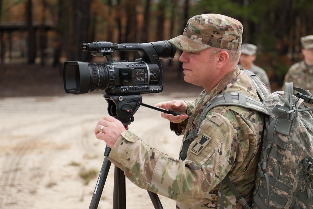 Staff Sgt. Jason Proseus, 416th Theater Engineer Command Public Affairs, films a M69 Training Hand Grenade throw at the 2017 Combined Best Warrior Competition at Joint Base McGuire-Dix-Lakehurst, April 27, 2017. Army Public Affairs personnel help establish the conditions that lead to confidence in America's Army and its readiness to conduct operations in peacetime, conflict and war (U.S. Army Reserve photo by Spc. Sean Harding/Released).