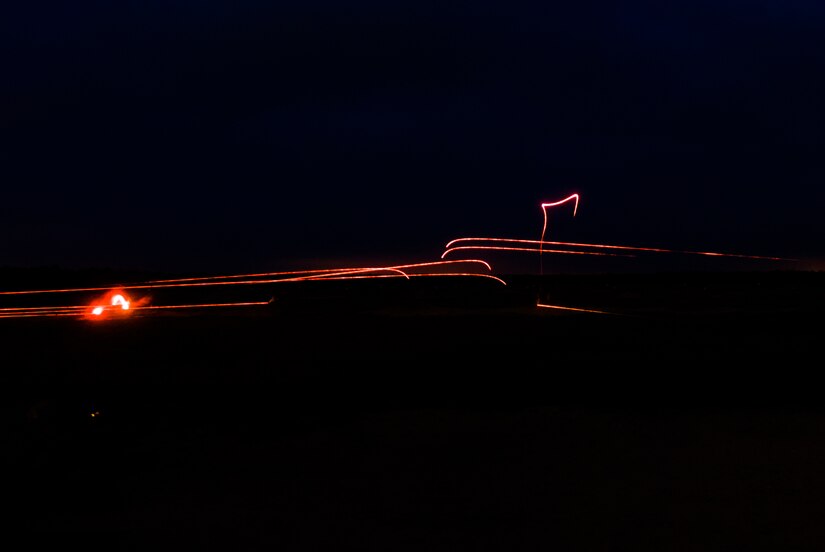 Tracer rounds are seen in the distance as competitors complete a night qualification of the M249 light machine gun at the 2017 Combined Best Warrior Competition, Joint Base McGuire-Dix-Lakehurst, April 26, 2017. The Combined Best Warrior Competition will decide which enlisted soldier and noncommissioned officer will represent the 412th Theater Engineer Command, 416th Engineer Command and 76th Operational Response Command at the United States Army Reserve Command Best Warrior Competition at Fort Bragg, North Carolina in June (U.S. Army Reserve Photo by Spc. Sean Harding/Released).