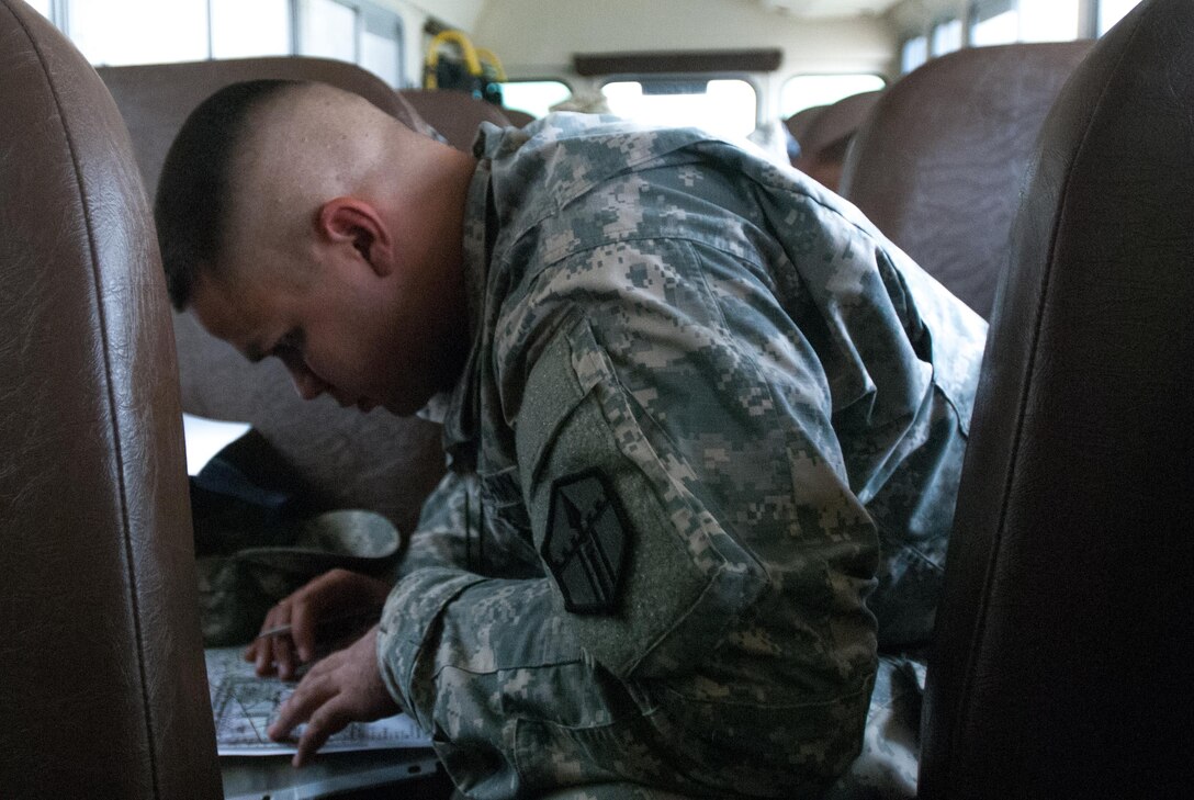 Sgt. Roberto Cruz of the 387th Engineer Company, 301st Maneuver Enhancement Brigade, plots navigation points on a map prior to the land navigation portion of the 2017 Combined Best Warrior Competition, Joint Base McGuire-Dix-Lakehurst, April 25, 2017. The Combined Best Warrior Competition will decide which enlisted soldier and noncommissioned officer will represent the 412th Theater Engineer Command, 416th Engineer Command and 76th Operational Response Command at the United States Army Reserve Command Best Warrior Competition at Fort Bragg, North Carolina in June (U.S. Army Reserve Photo by Spc. Sean Harding/Released).