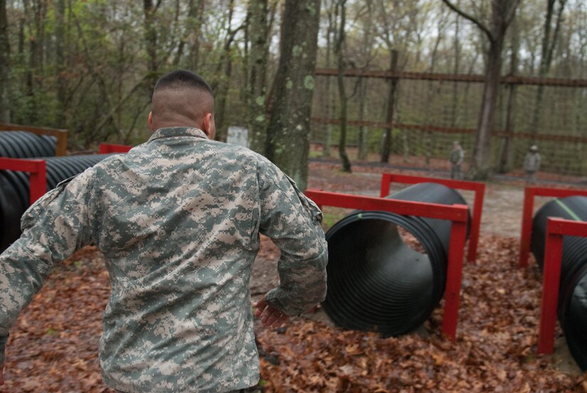 Sgt. Roberto Cruz, 315th Engineer Battalion, 301st Maneuver Enhancement Brigade, prepares to enter a tunnel at the obstacle course portion of the 2017 Combined Best Warrior Competition, Joint Base McGuire-Dix-Lakehurst, April 25, 2017. The Combined Best Warrior Competition will decide which enlisted soldier and noncommissioned officer will represent the 412th Theater Engineer Command, 416th Engineer Command and 76th Operational Response Command at the United States Army Reserve Command Best Warrior Competition at Fort Bragg, North Carolina in June (U.S. Army Reserve Photo by Spc. Sean Harding/Released).