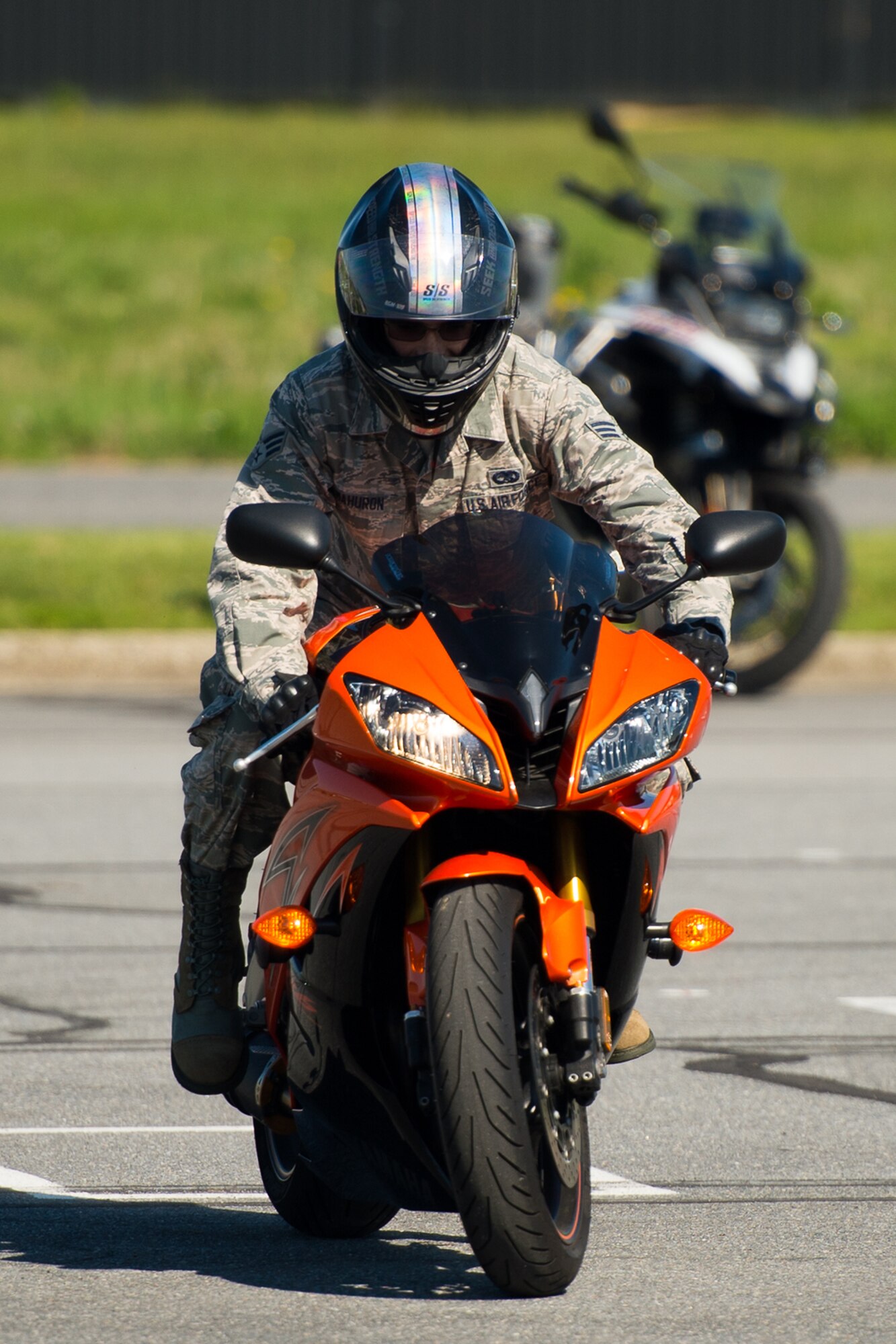 Senior Airman Jacob Mahuron, 436th Maintenance Squadron aerospace propulsion journeyman, participates in the slow drag competition at the Motorcycle Safety Day April 28, 2017, at Dover Air Force Base, Del. The object of the race is to be the last to cross the finish line by driving as slow as possible. Contestants are eliminated if their feet touch the ground. (U.S. Air Force photo by Mauricio Campino)