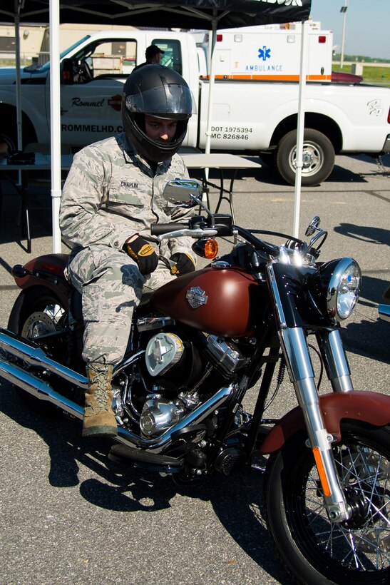 Capt. James Chaplin, 436th Aerial Port Squadron Air Freight Flight commander, prepares for a test drive at the Motorcycle Safety Day April 28, 2017, at Dover Air Force Base, Del. Rommel Harley Davidson of Smyrna, Del. brought out four different style motorcycles and offered free test rides at the event. (U.S. Air Force photo by Mauricio Campino)