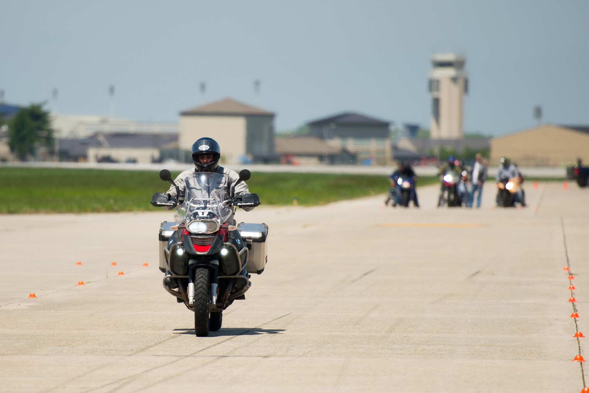 Riders participate in a high- speed braking exercise on the taxiway foxtrot during the Motorcycle Safety Day April 28, 2017, at Dover Air Force Base, Del. Speed is a factor in many two-wheeled mishaps and the ability to brake effectively at highway speeds can be a lifesaving skill. (U.S. Air Force photo by Mauricio Campino)