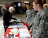 Airman 1st Class Rachael Jonas and Airman 1st Class Jacquelyn Clark, emergency management technicians assigned to the 28th Civil Engineer Squadron, explain the different pamphlets and information booklets for the Prepare-A-Thon inside The Exchange at Ellsworth Air Force Base, S.D., April 26, 2017. The pamphlets included recommended items people should have in emergency situations, such as tornadoes and blizzards.  (U.S. Air Force photo by Airman Nicolas Z. Erwin)