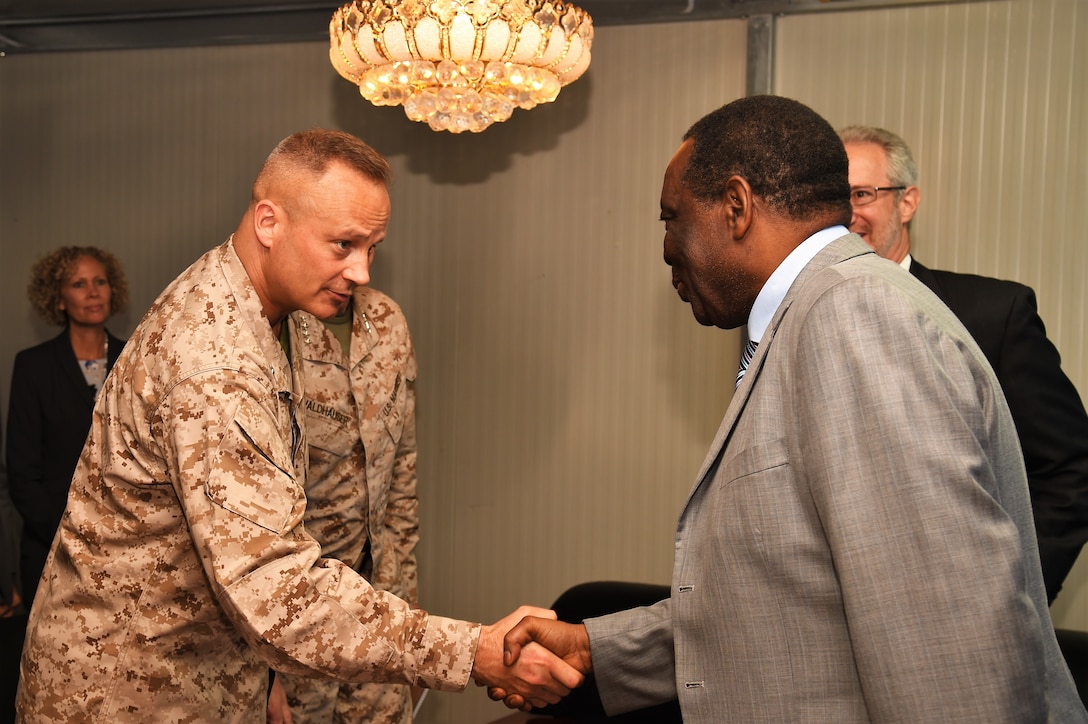 Marine Corps Brig. Gen. David J. Furness, commander of Combined Joint Task Force Horn of Africa, and Ambassador Francisco Caetano Jose Madeira, the special representative of the chairperson of the African Union Commission for Somalia, exchange greetings before their meeting at Mogadishu International Airport, Somalia, April 29, 2017. Air National Guard photo by Tech. Sgt. Andria Allmond