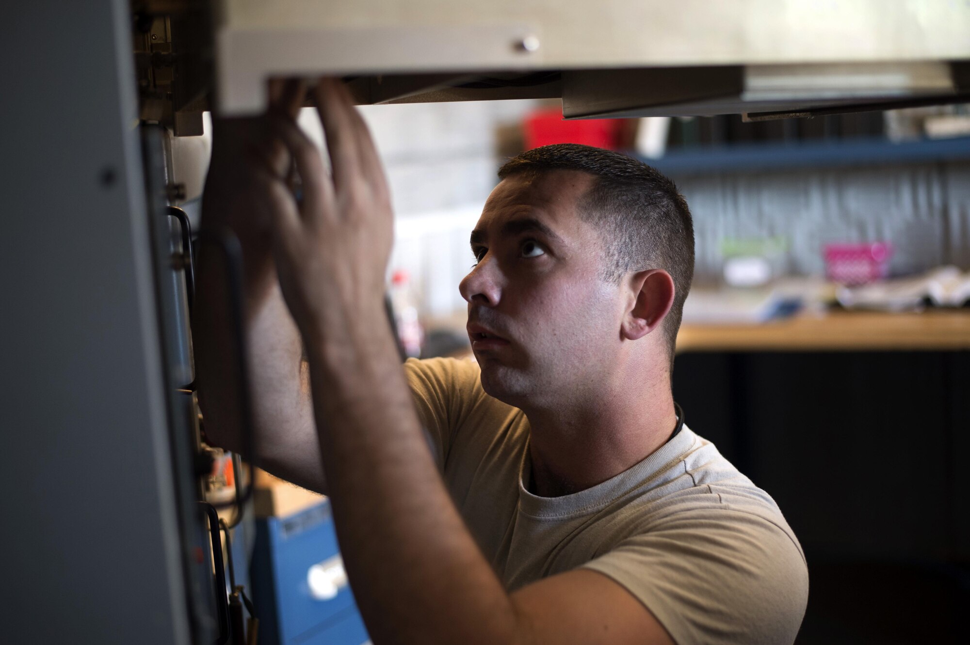 U.S. Air Force Senior Airman Sean Fitzpatrick, an airfield systems technician with the 6th Operations Support Squadron, works on the Tactical Air Navigation System April 27, 2017, at MacDill Air Force Base, Fla. The TACAN provides bearing and distance from an aircraft to the ground in order to help the pilots safely land. (U.S. Air Force photo by Airman 1st Class Rito Smith) 