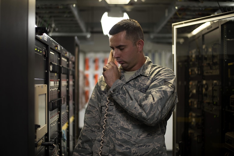 U.S. Air Force Senior Airman Sean Fitzpatrick, an airfield systems technician with the 6th Operations Support Squadron, communicates with Airmen in the Air Traffic Control Tower April 27, 2017, at MacDill Air Force Base, Fla. Airfield systems technicians maintain equipment needed for controllers to communicate with pilots. (U.S. Air Force photo by Airman 1st Class Rito Smith) 