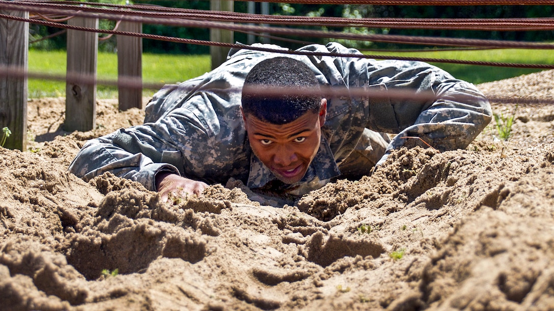Army Sgt. Marc Doss low-crawls during the National Guard Region III Best Warrior Competition at the Wendell H. Ford Regional Training Center in Greenville, Ky., April 24, 2017. The three-day competition determined which soldier and noncommissioned officer would compete against the best guardsmen nationwide. Army National Guard photo by Staff Sgt. Scott Raymond