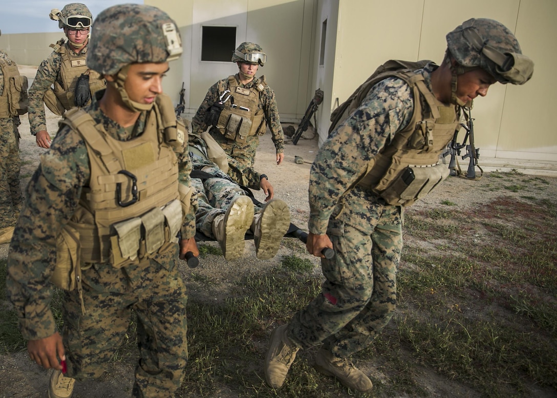 MARINE CORPS BASE CAMP PENDLETON, Calif., Marines with the Combat Battalion 15, 15th Marine Expeditionary Unit carry a notional wounded Marine in a litter bearer during a combat life saver course part PHIBRON-MEU integration training at Camp Pendleton, April 6, 2017. This first at-sea exercise provides the Marines the opportunity to practice integrating with their Navy counterparts to form an efficient team capable of accomplishing a range of missions around the globe. This Navy-Marine Corps team supports combatant commanders in maintaining regional maritime security and stability while providing offshore options to deter influence and win in an era of uncertainty. (U.S. Marine Corps photo by Cpl. Frank Cordoba)