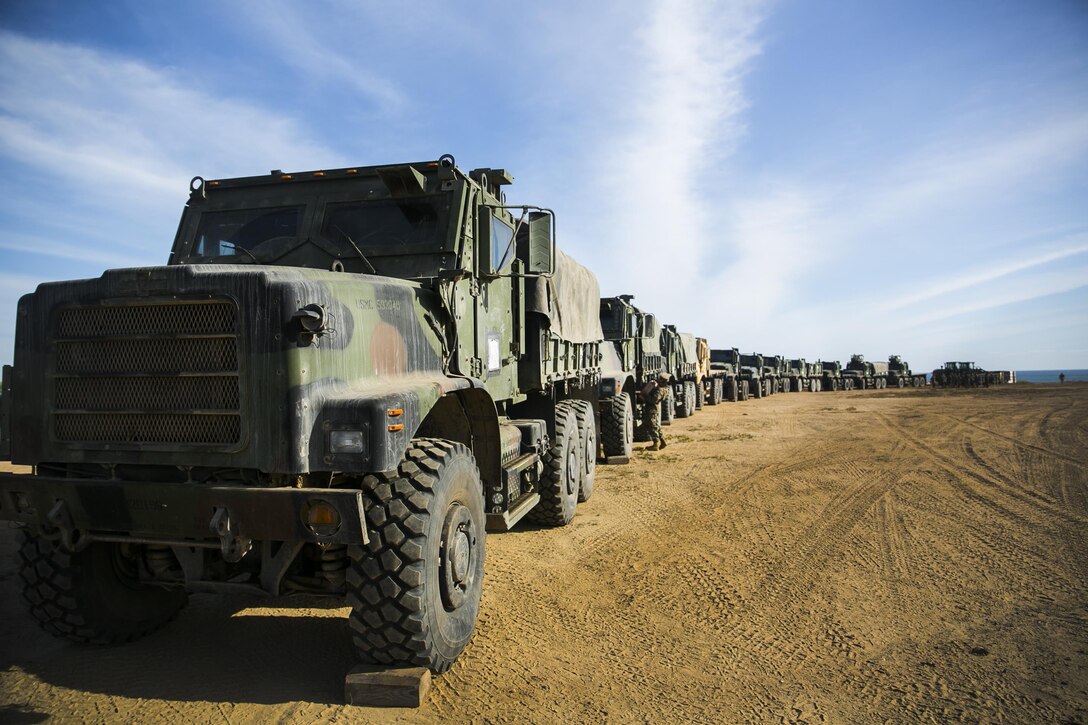 MARINE CORPS BASE CAMP PENDLETON, Calif. – Marines with Combat Logistics Battalion 15, 15th Marine Expeditionary Unit line up seven-ton trucks before conducting convoy rehearsals during PHIBRON-MEU integration training at Camp Pendleton, April 8, 2017. This first at-sea exercise provides the Marines the opportunity to practice integrating with their Navy counterparts to form an efficient team capable of accomplishing a range of missions around the globe. This Navy-Marine Corps team supports combatant commanders in maintaining regional maritime security and stability while providing offshore options to deter influence and win in an era of uncertainty.   (U.S. Marine Corps photo by Cpl. Frank Cordoba)