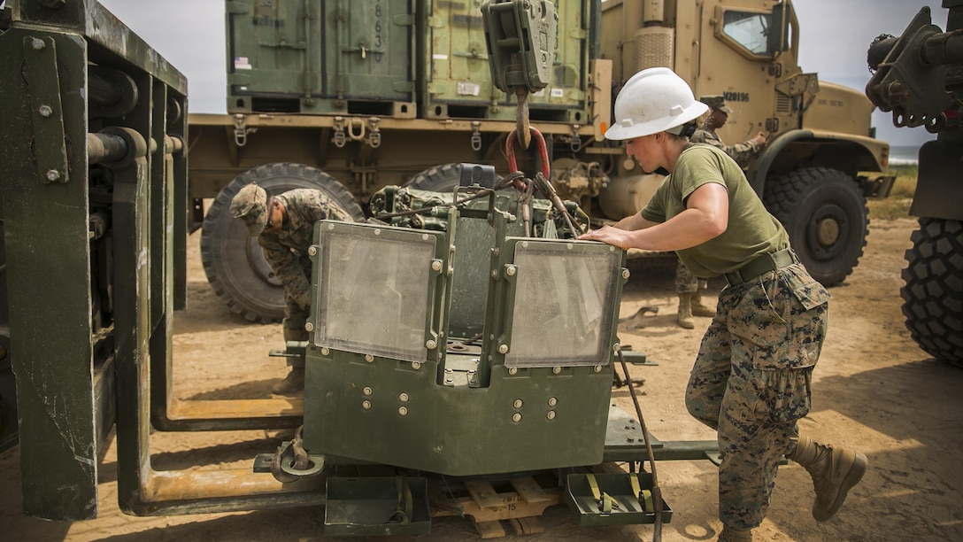 MARINE CORPS BASE CAMP PENDLETON, Calif. – Cpl. Madison Fitzgerald a motor transportation operator with Combat Logistics 15, 15th Marine Expeditionary Unit, adjusts a turret station into a vehicle during PHIBRON-MEU integrated training at Camp Pendleton, April 9, 2017. This first at-sea exercise provides the Marines the opportunity to practice integrating with their Navy counterparts to form an efficient team capable of accomplishing a range of missions around the globe. This Navy-Marine Corps team supports combatant commanders in maintaining regional maritime security and stability while providing offshore options to deter influence and win in an era of uncertainty. (U.S. Marine Corps photo by Cpl. Frank Cordoba)