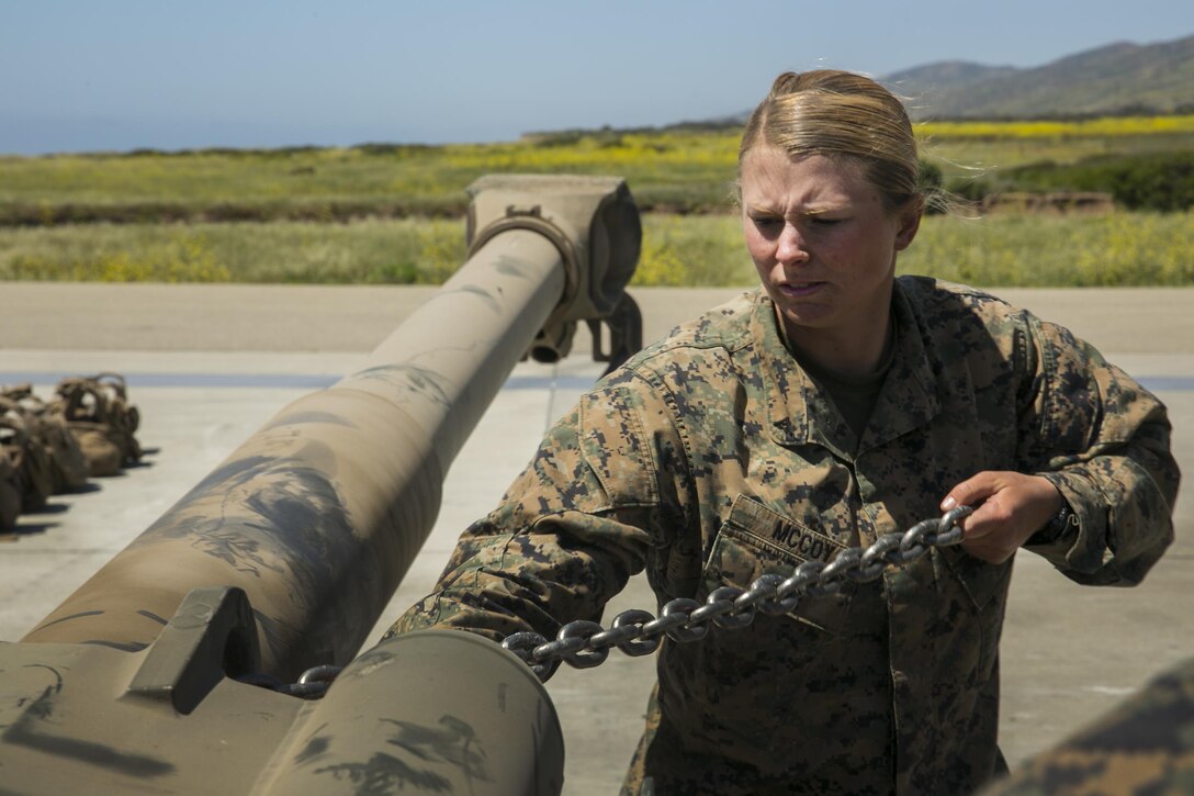 MARINE CORPS BASE CAMP PENDLETON, Calif. – Lance Cpl. Caitlin Mccoy a landing support specialist with Combat Logistics Battalion 15, 15th Marine Expeditionary Unit, secures chains to a M777 howitzer during phibron meu integrated training at Camp Pendleton, April 12, 2017. PMINT lays the foundation for all the elements of the MEU to develop relationships with their Navy counterparts and gain an understanding of the teamwork required to accomplish the mission. (U.S. Marine Corps photo by Cpl. Frank Cordoba)